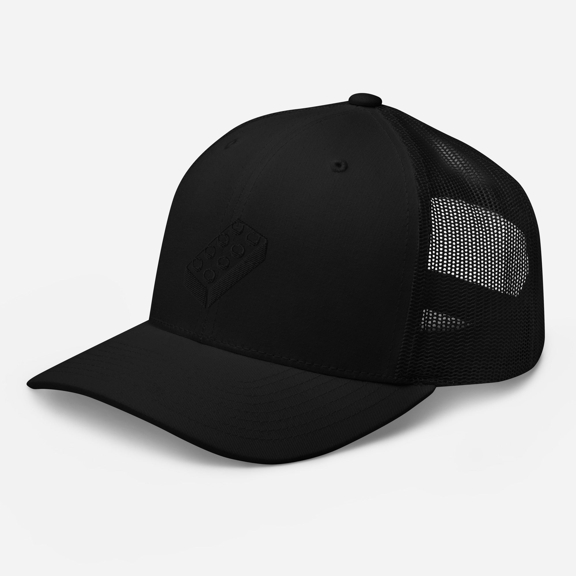 a black trucker cap with a lego embroidered brick design